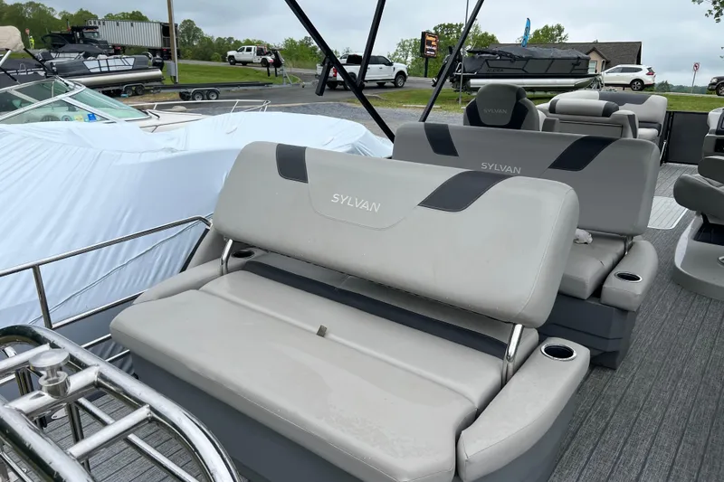 Slide: The Image of 2021 Sylvan L5 DLZ boat interior with gray seating and cup holders. - 14