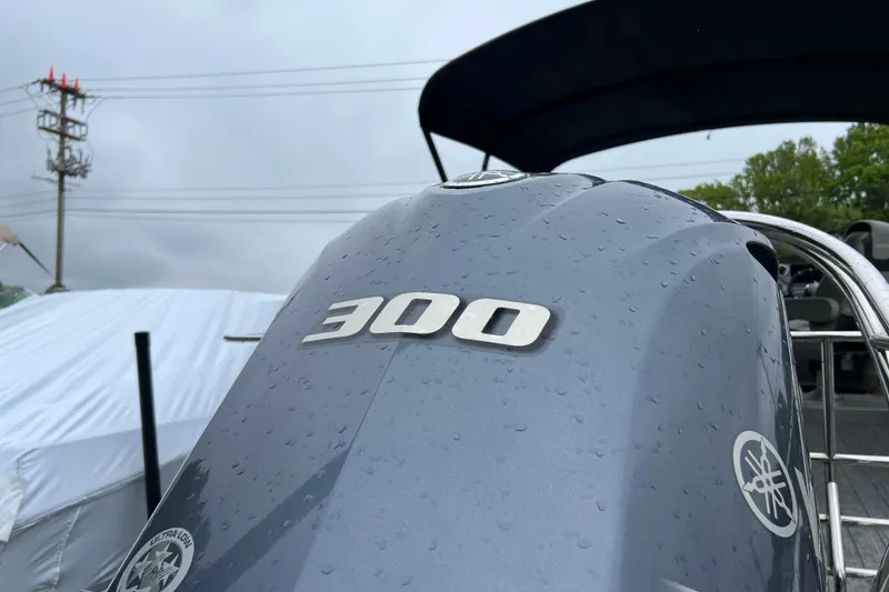 Slide: The Image of Close-up of a Yamaha 300 outboard motor on a 2021 Sylvan L5 DLZ boat. - 3