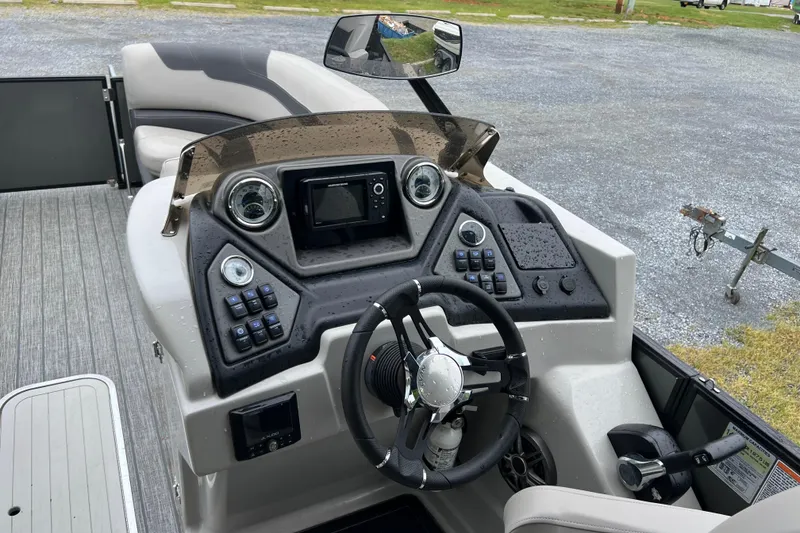 Slide: The Image of Cockpit of 2021 Sylvan L5 DLZ boat with modern controls and steering wheel. - 7