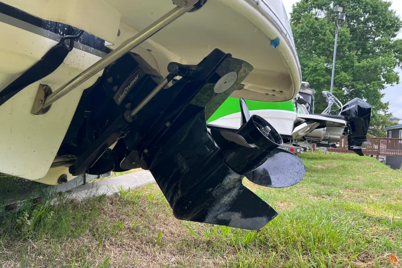 Slide: The Image of 2005 Chaparral 204 SSi boat with MerCruiser outdrive, parked on grass. - 4