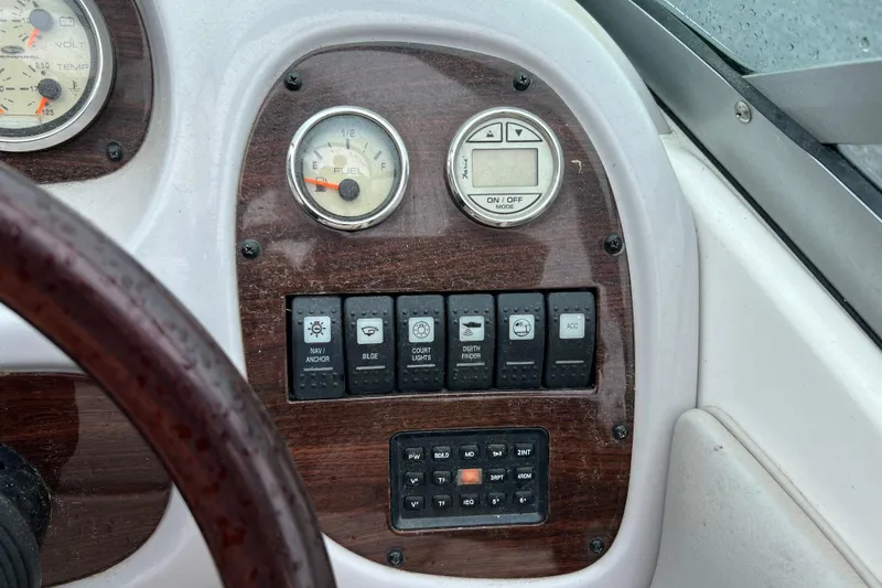 Slide: The Image of Dashboard of a 2005 Chaparral 204 SSi boat with gauges and control switches. - 7