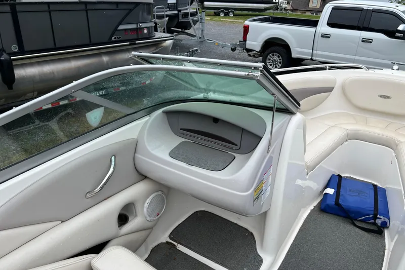 Slide: The Image of Interior of a 2005 Chaparral 204 SSi boat with seating and storage compartments. - 8