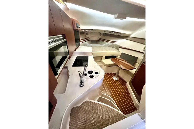 Slide: The Image of Luxurious interior of 2017 Grady-White Express 330 boat with modern kitchen and seating area. - 10