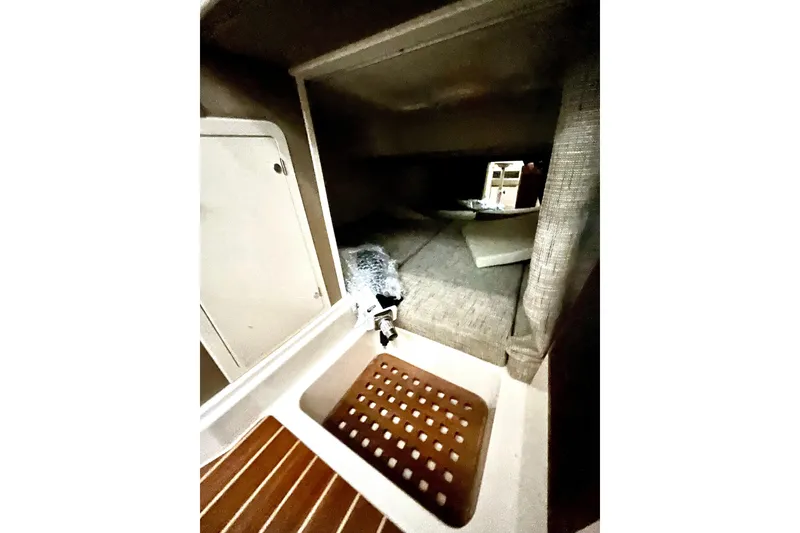 Slide: The Image of Interior cabin view of 2017 Grady-White Express 330 boat, featuring cozy sleeping area. - 15