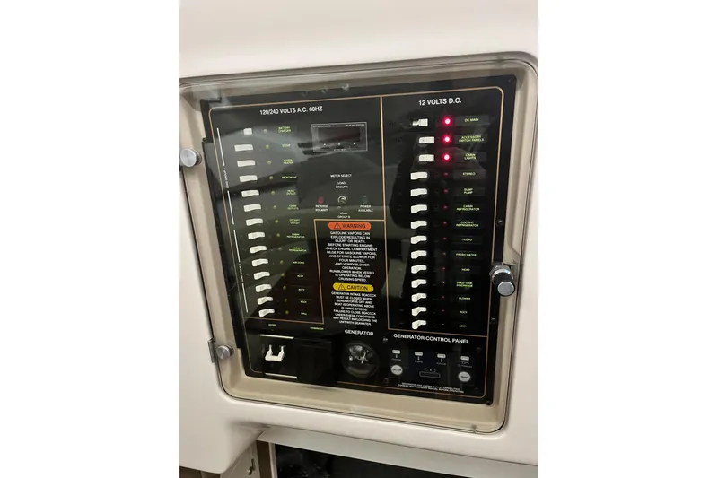 Slide: The Image of Electrical control panel on a 2017 Grady-White Express 330 boat. - 16