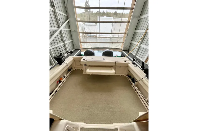 Slide: The Image of 2017 Grady-White Express 330 boat interior in storage, showcasing spacious deck and equipment. - 5