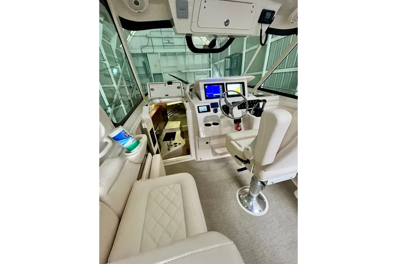 Slide: The Image of Interior of 2017 Grady-White Express 330 boat with modern helm and seating. - 8