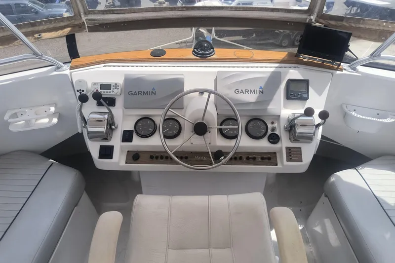 Slide: The Image of Helm of 2000 Mainship 390 Trawler with Garmin navigation system and dual controls. - 20