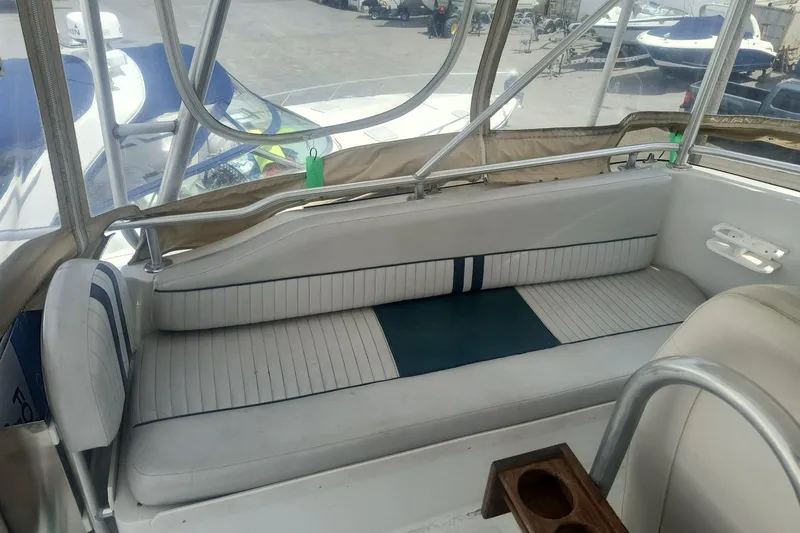 Slide: The Image of Interior seating of a 2000 Mainship 390 Trawler with striped upholstery. - 22