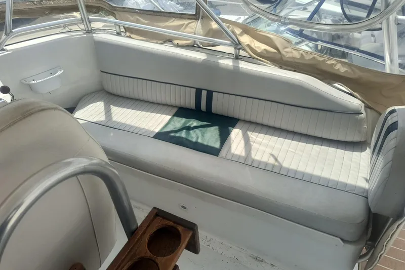 Slide: The Image of Interior seating of 2000 Mainship 390 Trawler with white and blue upholstery. - 23
