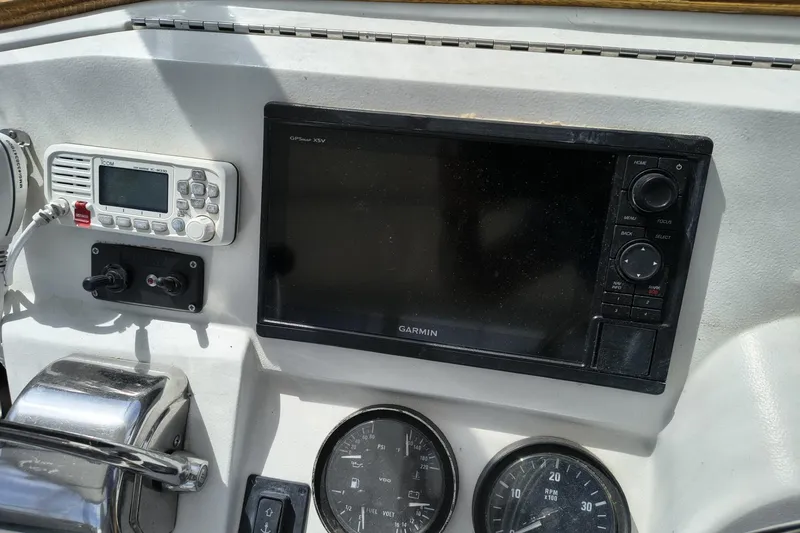 Slide: The Image of Control panel of a 2000 Mainship 390 Trawler with Garmin GPS and radio equipment. - 26