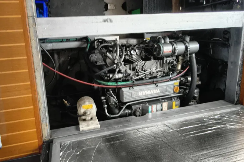 Slide: The Image of Engine compartment of a 2000 Mainship 390 Trawler, featuring a Yanmar marine engine. - 28