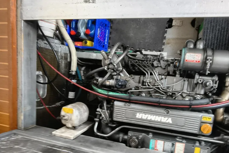 Slide: The Image of Engine compartment of a 2000 Mainship 390 Trawler with Yanmar engine components. - 30
