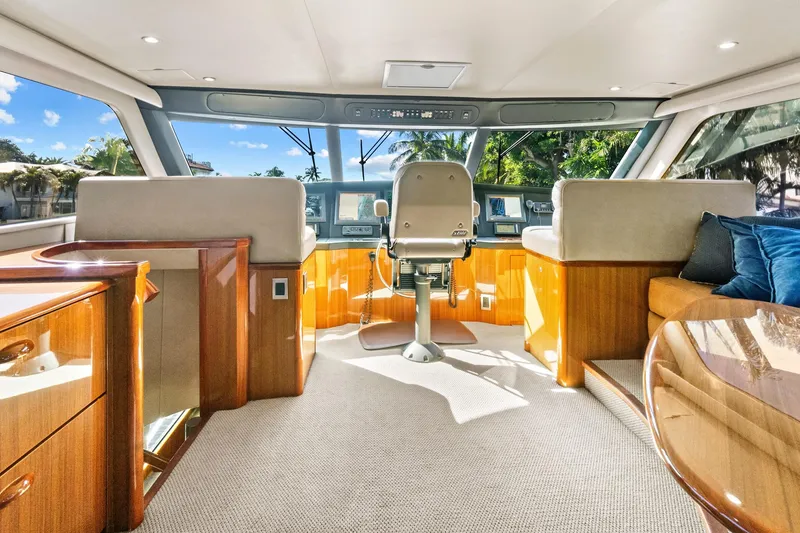 Slide: The Image of Luxurious interior of 2008 Viking 74 Enclosed Bridge yacht with plush seating and modern helm. - 23