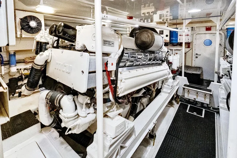 Slide: The Image of Engine room of 2008 Viking 74 Enclosed Bridge yacht, featuring powerful machinery and clean design. - 67