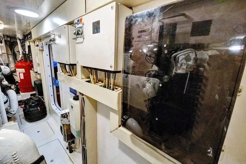 Slide: The Image of Engine room of 2008 Viking 74 Enclosed Bridge yacht with electrical panels and equipment. - 74