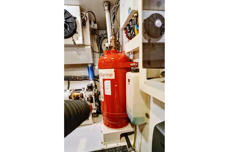 Slide: The Image of Engine room of 2008 Viking 74 Enclosed Bridge with fire suppression system. - 77
