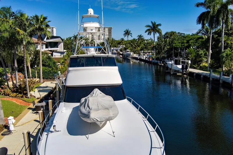 Slide: The Image of Luxury 2008 Viking 74 Enclosed Bridge yacht docked in scenic canal setting. - 9