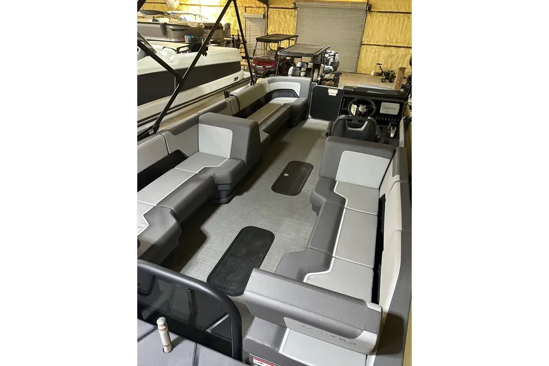 Slide: The Image of 2025 Manitou Cruise 22 Max Switchback interior with spacious seating and modern design. - 2