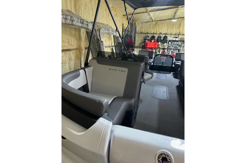 Slide: The Image of 2025 Manitou Cruise 22 Max Switchback interior with modern seating and spacious layout. - 3