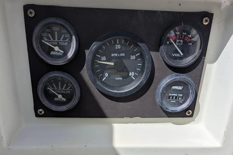 Slide: The Image of Instrument panel of a 1980 SCEPTRE 36 boat showing gauges for RPM, voltage, and temperature. - 11
