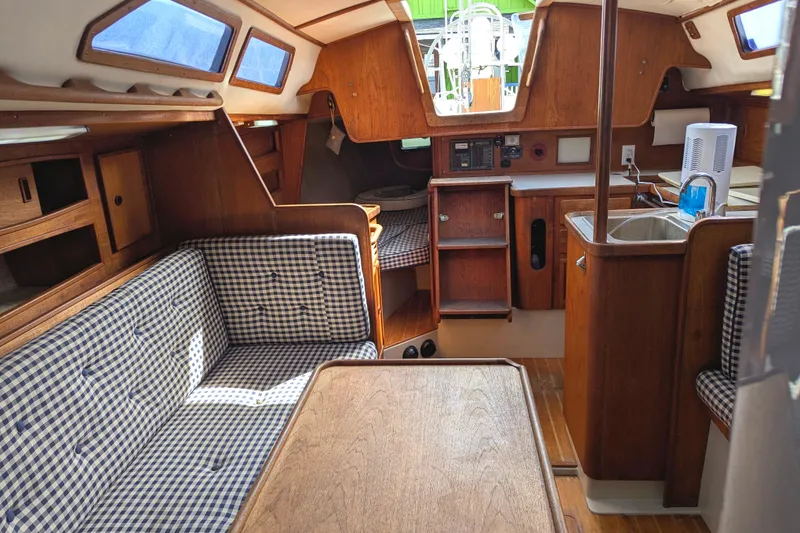 Slide: The Image of Interior of 1980 SCEPTRE 36 sailboat with wood finish and checkered seating. - 19