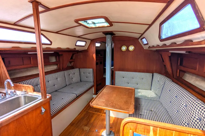 Slide: The Image of Interior of 1980 SCEPTRE 36 sailboat with wood finish and checkered seating. - 21