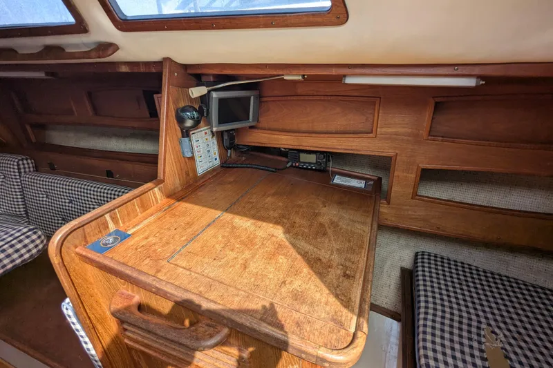 Slide: The Image of Interior of 1980 SCEPTRE 36 sailboat with wooden table and navigation equipment. - 22