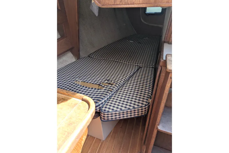 Slide: The Image of Interior cabin of 1980 SCEPTRE 36 with checkered cushions and wooden finish. - 26