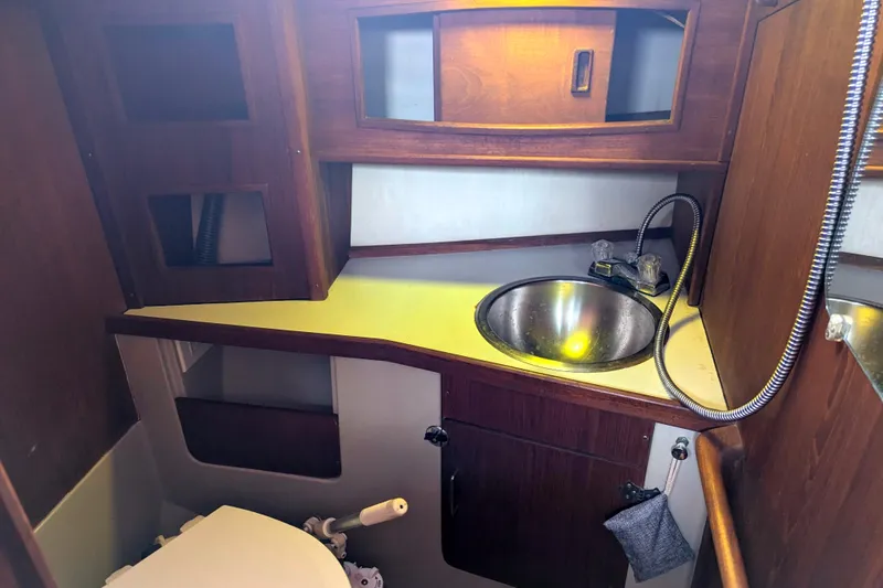 Slide: The Image of Interior of 1980 SCEPTRE 36 boat bathroom with sink and wooden cabinetry. - 27