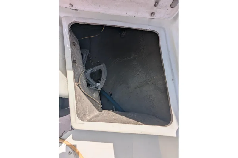 Slide: The Image of Open hatch on 1980 SCEPTRE 36 sailboat, showing interior storage space. - 35
