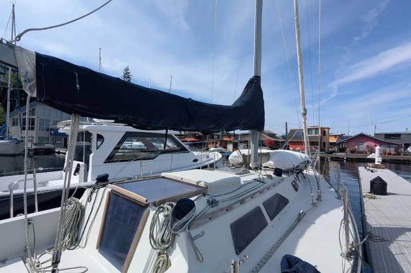 Slide: The Image of 1980 SCEPTRE 36 sailboat docked at marina under clear blue sky. - 4