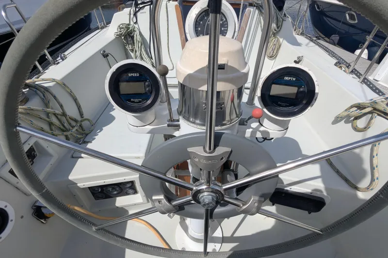 Slide: The Image of Cockpit of 1980 SCEPTRE 36 sailboat with steering wheel and navigation instruments. - 9