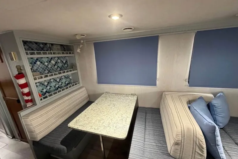 Slide: The Image of Cozy bedroom in 1996 Gibson Sport 41 boat with floral bedding and window view. - 7