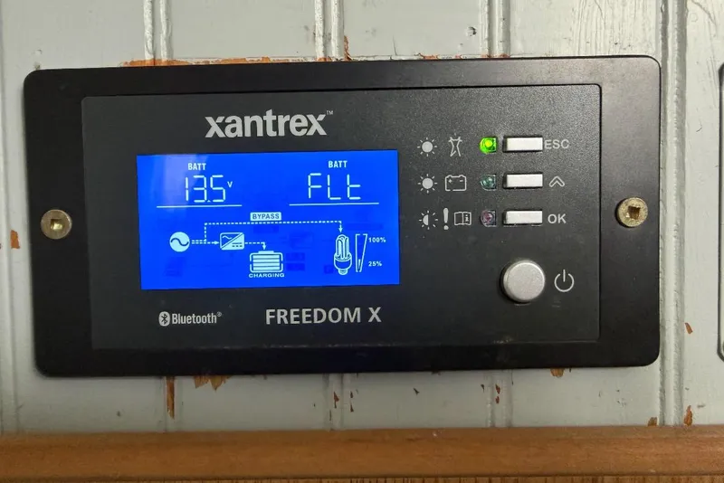 Slide: The Image of Xantrex Freedom X control panel displaying battery status on a 1996 Gibson Sport 41. - 9