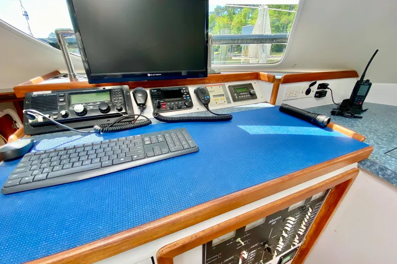 Slide: The Image of Navigation station of a 1998 Manta 40 yacht with communication equipment and monitor. - 21