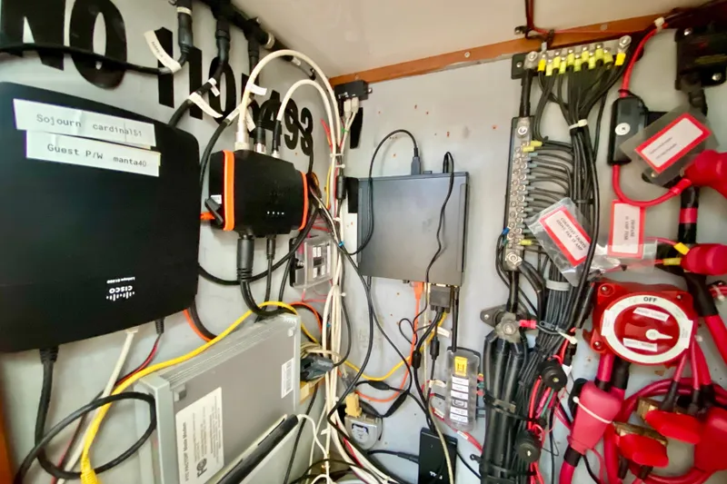 Slide: The Image of Electrical panel with wiring and devices in a 1998 Manta 40 boat. - 25