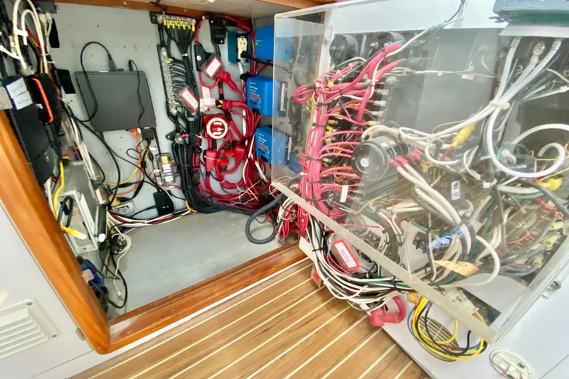 Slide: The Image of Electrical wiring and components inside a 1998 Manta 40 boat's control panel. - 26