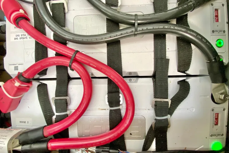 Slide: The Image of Battery setup with red and black cables, Manta 40 model, 1998. - 39