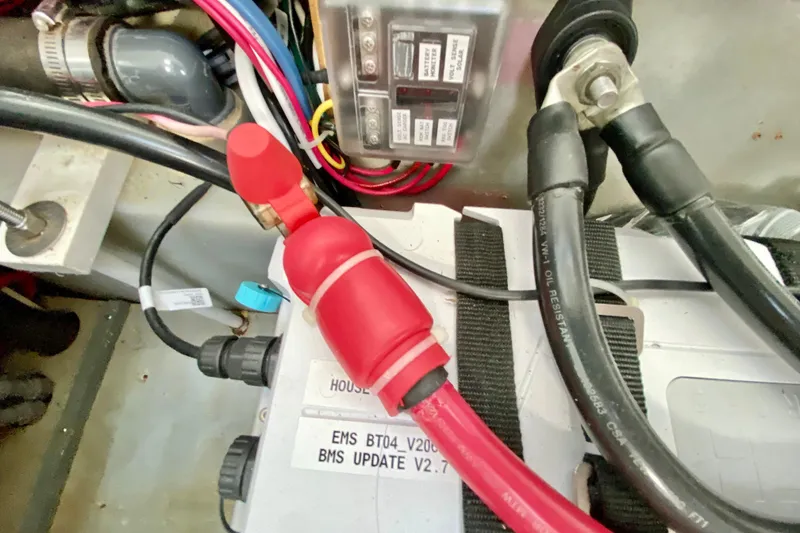Slide: The Image of Electrical components and wiring inside a 1998 Manta 40 boat. - 42
