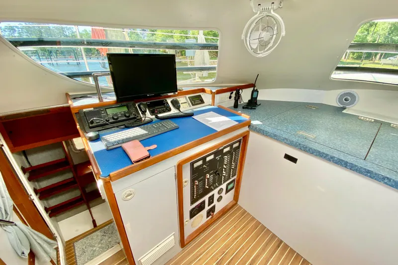 Slide: The Image of Navigation station of a 1998 Manta 40 yacht with control panel and equipment. - 45