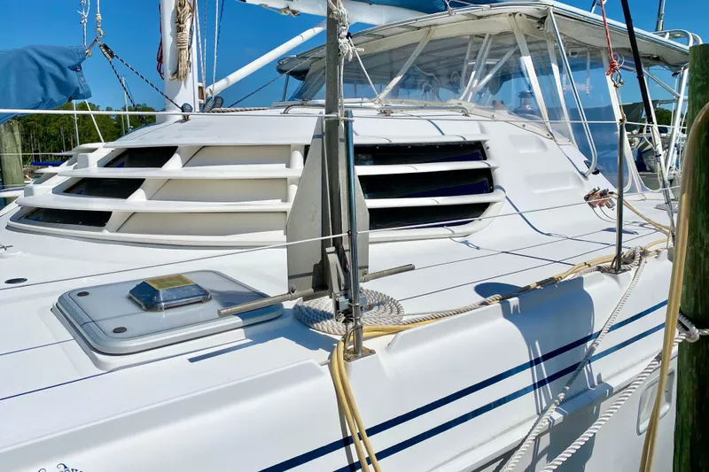 Slide: The Image of 1998 Manta 40 sailboat with sleek white deck and ventilation vents. - 5