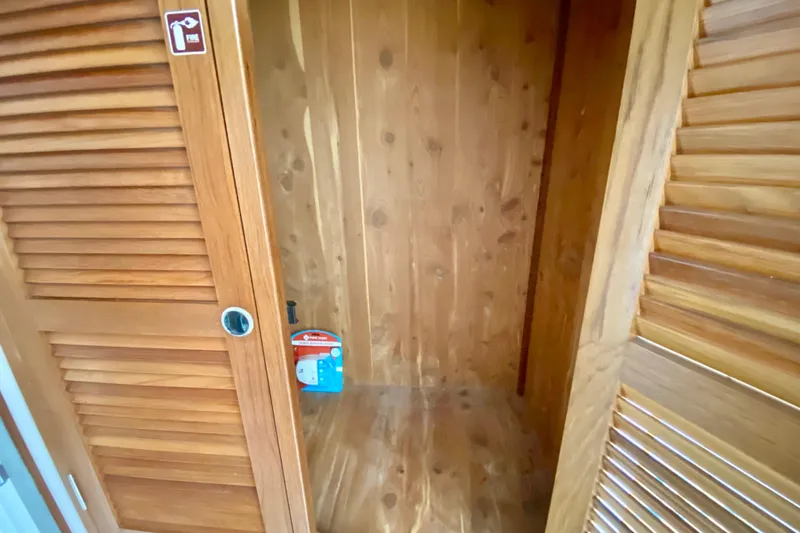 Slide: The Image of Wooden closet interior with fire extinguisher sign, Manta 40, 1998 model. - 50