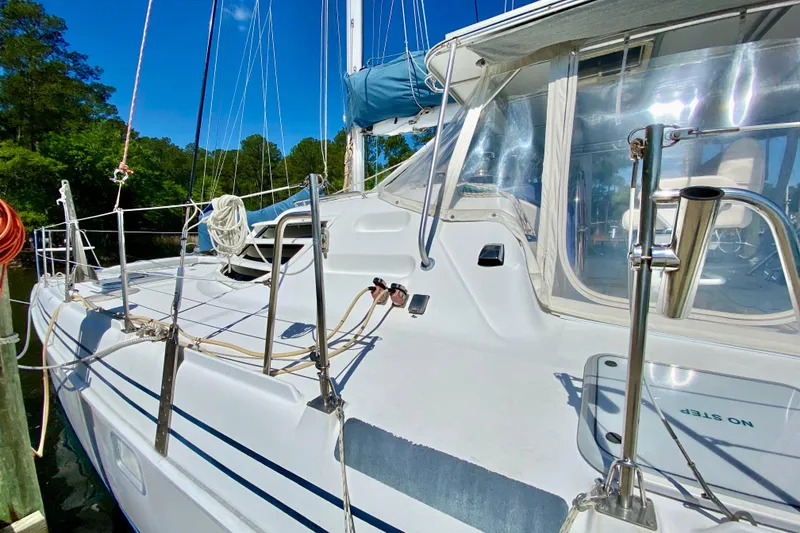 Slide: The Image of Sailboat deck of 1998 Manta 40, featuring sleek design and clear canopy. - 6