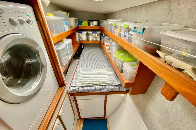 Slide: The Image of Laundry area with storage and bed in 1998 Manta 40 yacht. - 69
