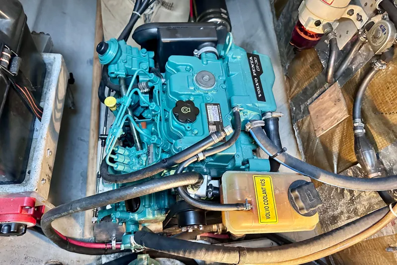 Slide: The Image of Engine compartment of a 1998 Manta 40 with Volvo Penta engine and coolant system. - 75