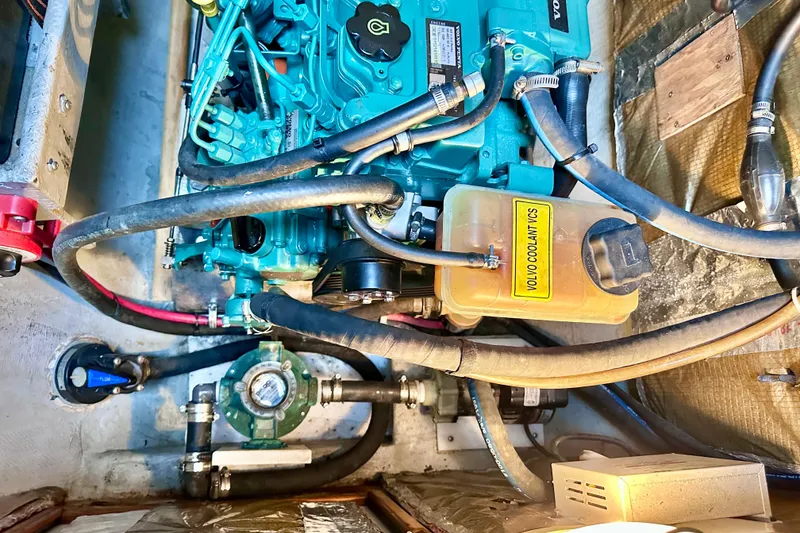 Slide: The Image of Engine compartment of a 1998 Manta 40 sailboat with Volvo coolant system. - 76