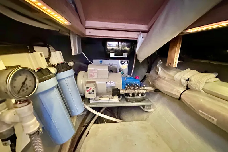 Slide: The Image of Engine room of a 1998 Manta 40 boat with water filtration system. - 82