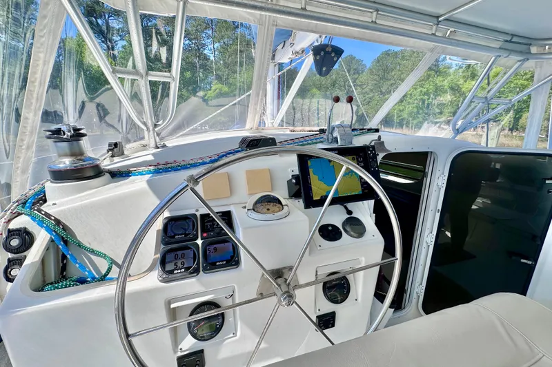 Slide: The Image of Cockpit of 1998 Manta 40 sailboat with navigation instruments and steering wheel. - 84