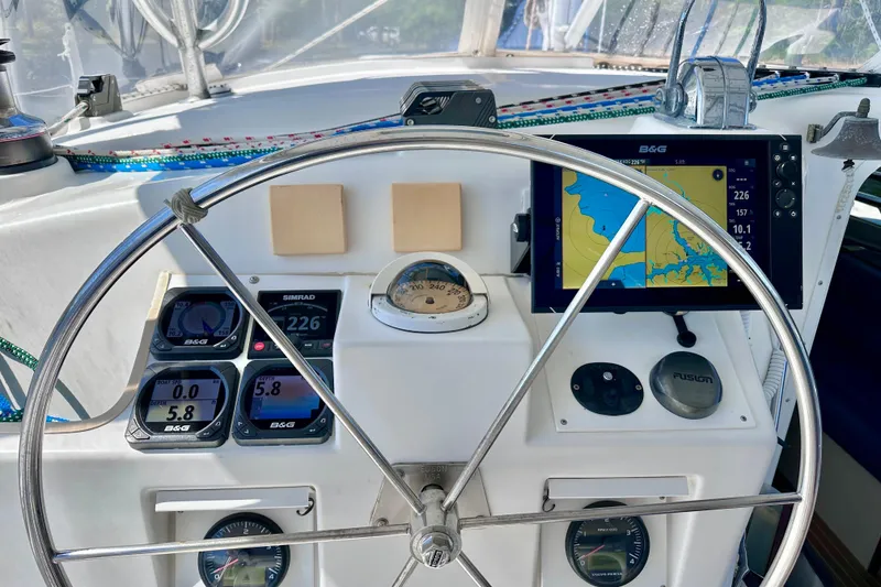 Slide: The Image of Sailboat cockpit with navigation instruments and steering wheel, Manta 40, 1998 model. - 86